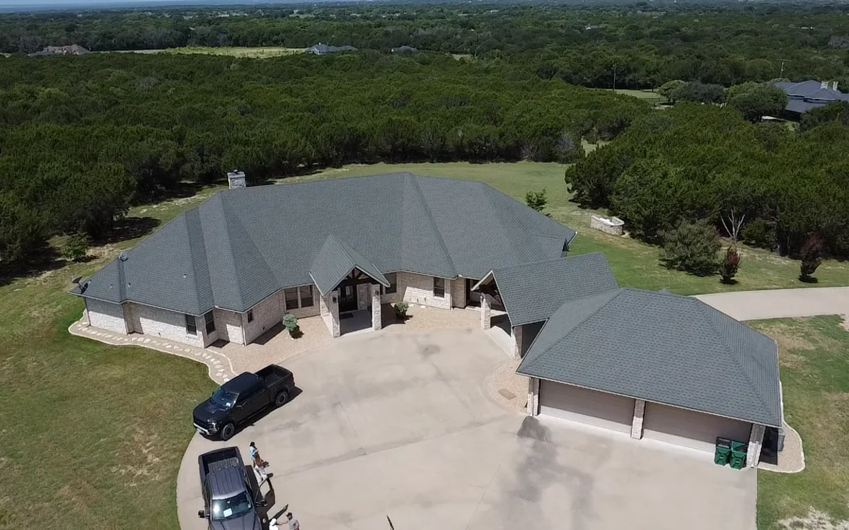 Completed roof on a large Texas home after restoration work